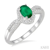 6x4 MM Oval Cut Emerald and 1/6 ctw Round Cut Diamond Ring in 10K White Gold