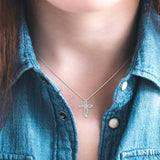 1/6 ctw Twirl Pattern Cross Round Cut Diamond Pendant With Link Chain in 10K White Gold
