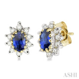 5x3MM Oval Cut Sapphire and 1/4 ctw Round Cut Diamond Earrings in 14K Yellow Gold