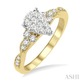 1/2 ctw Pear Shape Center Crisscross Carved Shank Lovebright Round Cut Diamond Engagement Ring in 14K Yellow and White Gold